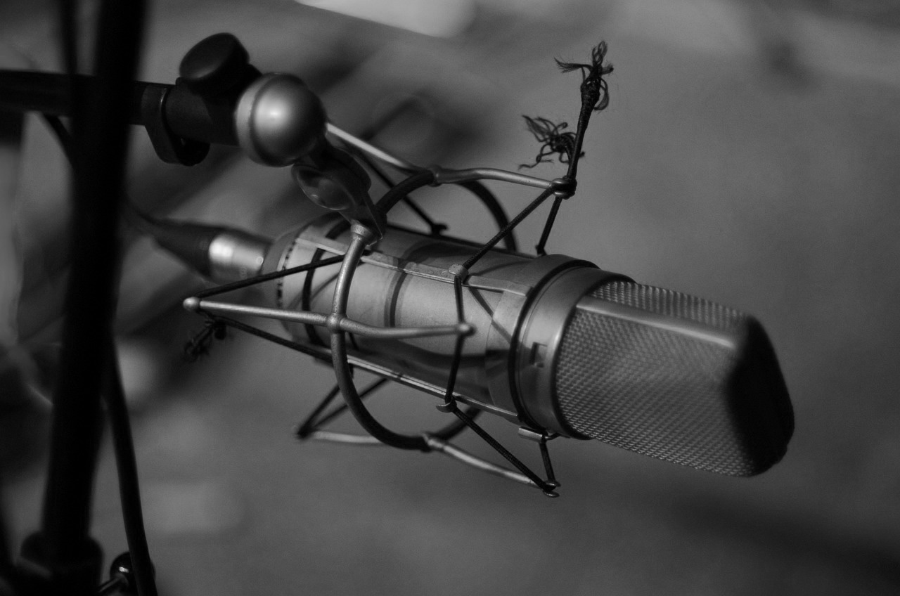 Black and white close up image of a microphone